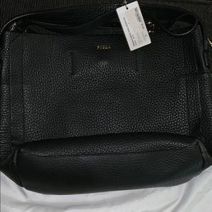 A black Furla purse